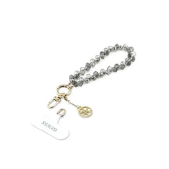 Guess Correa de Muñeca para Teléfono – Correa Negra con Cristales y Charms, Sujeción Segura y Diseño Elegante